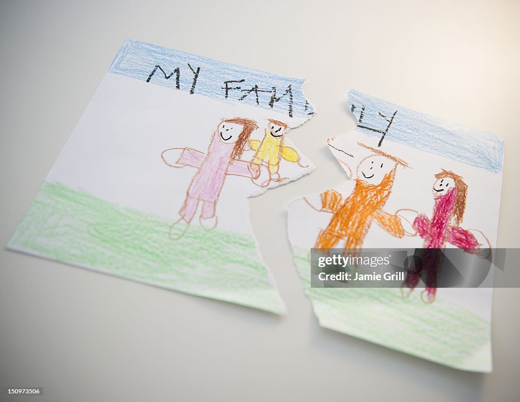 Torn child's drawing depicting family