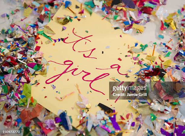 close up of greeting card with confetti - it's a girl stock-fotos und bilder