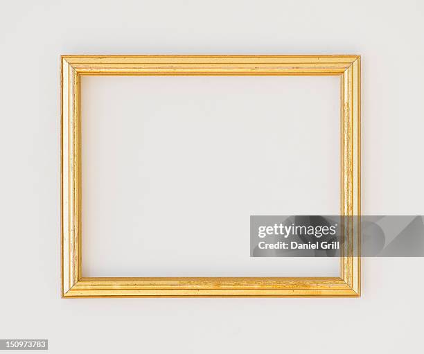close up of empty picture frame, studio shot - gold rectangle stock pictures, royalty-free photos & images