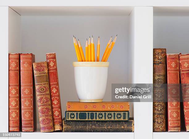 close up of books and pencils on shelf, studio shot - old book cover stock pictures, royalty-free photos & images