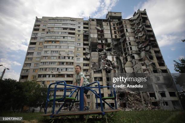 Years-old Rostislav plays in front of destroyed building in Kharkiv, Ukraine on July 06, 2023. She lives in front of the destroyed building, was also...