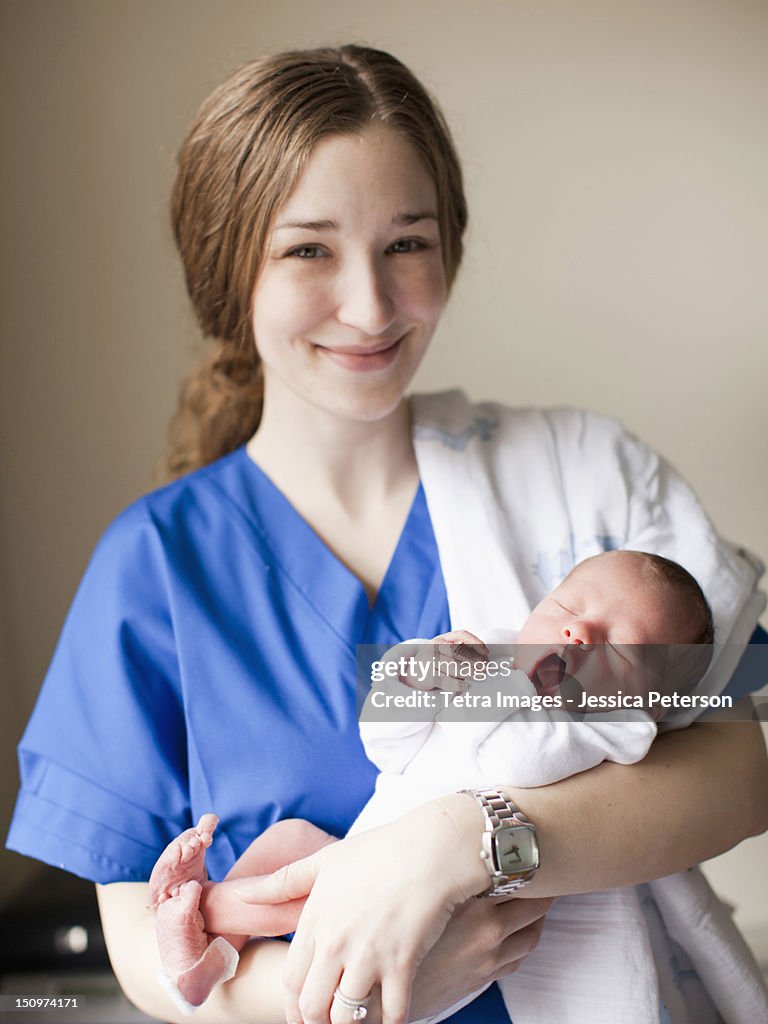 USA,Utah, Salt Lake City, Portrait of young attractive female nurse