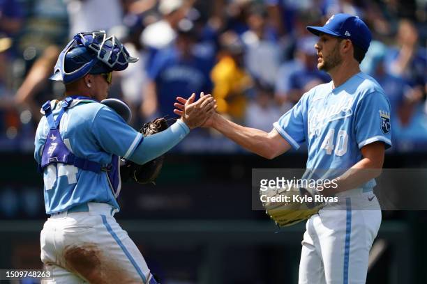 Collin Snider of the Kansas City Royals celebrates with Freddy Fermin after defeating the Los Angeles Dodgers at Kauffman Stadium on July 02, 2023 in...