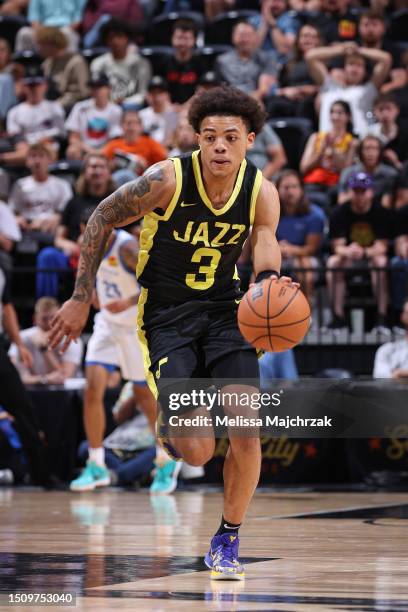 Keyonte George of the Utah Jazz dribbles the ball during the game against the Oklahoma City Thunder during the 2023 NBA Salt Lake City Summer League...