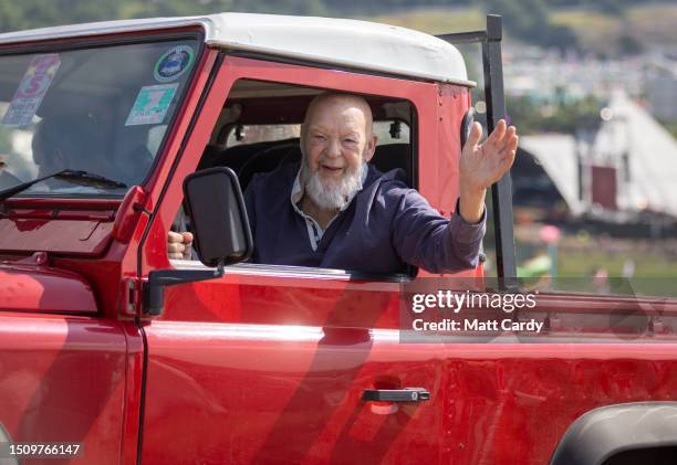 Festival founder Michael Eavis waves from his red Land Rover Defender as he tours the site at Worthy Farm, Pilton on Day 1 of Glastonbury Festival...