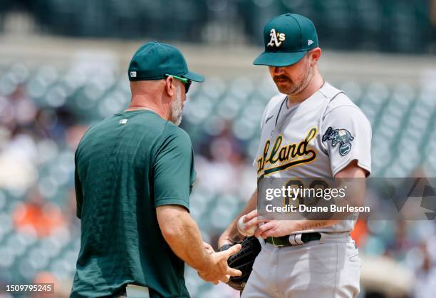 Starting pitcher Hogan Harris of the Oakland Athletics is removed from the game against the Detroit Tigers by manager Mark Kotsay during the fifth...