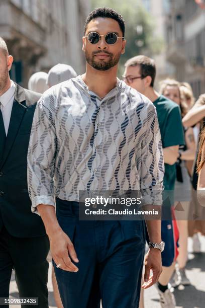 Regé-Jean Page, wearing a blue trousers, black sunglasses and grey shirt, is seen outside Giorgio Armani show during the Milan Fashion Week -...