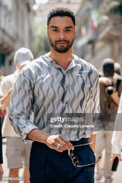 Regé-Jean Page, wearing a blue trousers, black sunglasses and grey shirt, is seen outside Giorgio Armani show during the Milan Fashion Week -...