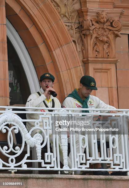 Steve Smith and Alex Carey of Australia sit on the dressing room balcony after Australia won the 2nd Test between England and Australia at Lord's...