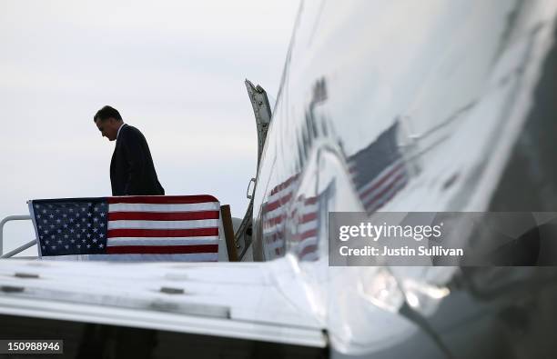 Republican presidential candidate, former Massachusetts Gov. Mitt Romney walks off of his campaign plane on August 29, 2012 in Tampa, Florida. As the...
