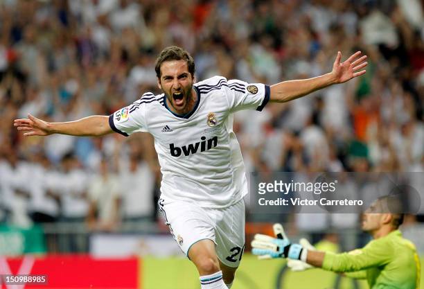 Gonzalo Higuain of Real Madrid celebrates after scoring the opening goal during the Supercopa second leg match between Real Madrid and FC Barcelona...