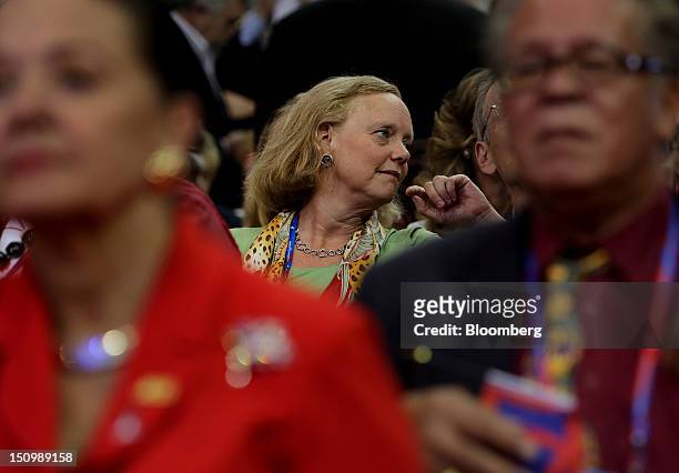 Meg Whitman, chief executive officer of Hewlett-Packard Co., center, attends the Republican National Convention in Tampa, Florida, U.S., on...