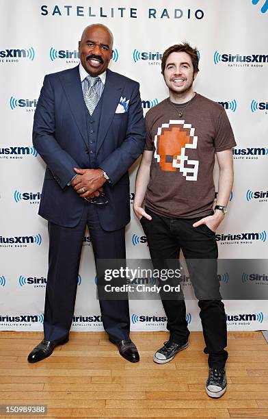 Comedian Steve Harvey poses with SiriusXM host Mark Seman at the SiriusXM Studio on August 29, 2012 in New York City.