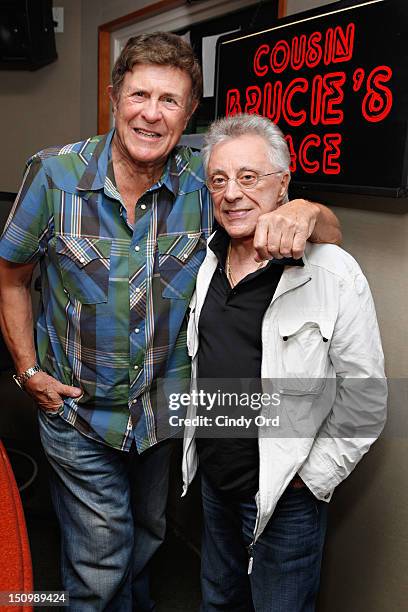 Legendary DJ Bruce 'Cousin Brucie' Morrow poses with singer Frankie Valli at the SiriusXM Studio on August 29, 2012 in New York City.