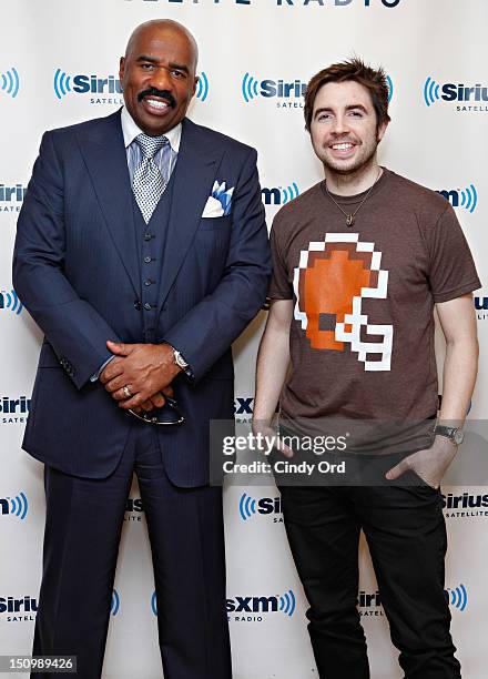 Comedian Steve Harvey poses with SiriusXM host Mark Seman at the SiriusXM Studio on August 29, 2012 in New York City.