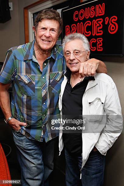 Legendary DJ Bruce 'Cousin Brucie' Morrow poses with singer Frankie Valli at the SiriusXM Studio on August 29, 2012 in New York City.