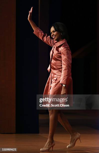 Former U.S. Secretary of State Condoleezza Rice waves as she takes the stage during the third day of the Republican National Convention at the Tampa...