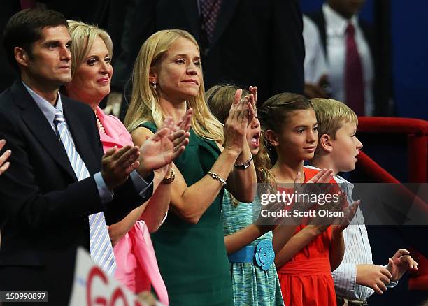 Mitt Romney's son Matt Romney, and wife Ann Romney, Paul Ryan's wife Janna Ryan, daughter Liza Ryan, Romney's grandchild Chloe Romney and Ryan's son,...