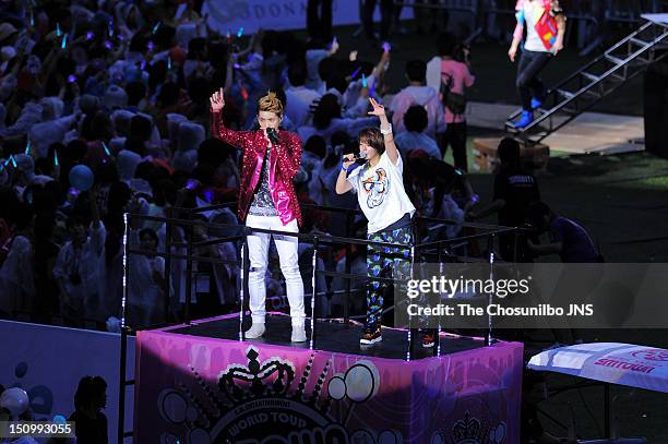 Kris of Exo-M and Amber of f perform during 'SM Town Live World Tour 3 In Seoul' at Jamsil Sports Complex on August 18, 2012 in Seoul, South Korea.