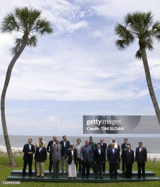 Leaders and guests of the Group of Eight Summit pose for a group picture 09 June 2004 on Sea Island in the southeastern coastal state of Georgia....