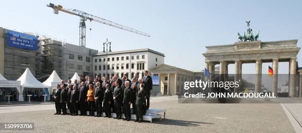 The heads of state of the 27 European Union nations pose for a family photo around German Chancellor Angela Merkel , whose country currently holds...