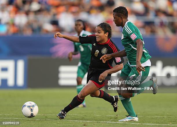 Ariana Martinez of Mexico challenges Ugo Njoku of Nigeria during the FIFA U-20 Women's World Cup Quarter-Final match between Nigeria and Mexico at...