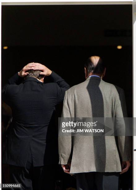 British Prime Minister Tony Blair and French President Jacques Chirac enter Gleneagles hotel for the first working session of a G8 summit 07 July...