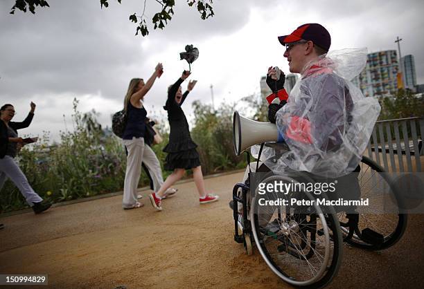 Volunteer welcomes spectators on day 1 of the London 2012 Paralympic Games at The Olympic Park on August 30, 2012 in London, England. The Paralympics...