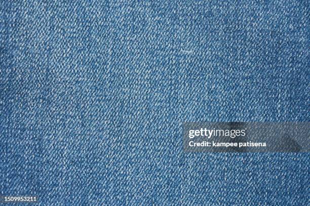 vintage blue denim texture background, close-up shot with subtle fading, perfect for fashion designers and bloggers - jeans fotografías e imágenes de stock