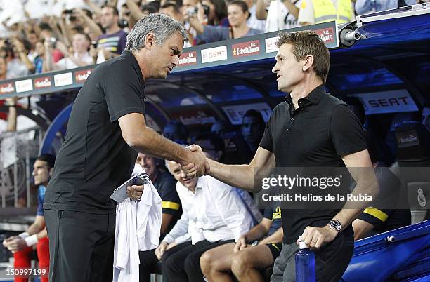 Head coach Jose Mourinho of Real Madrid shakes hands with Tito Vilanova of Barcelona before the Supercopa second leg match between Real Madrid and FC...