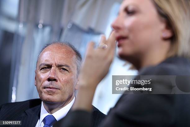 Stephane Richard, chief executive officer of France Telecom SA, left, pauses during a Bloomberg Television interview at the Mouvement des Enterprises...