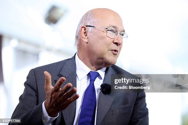 Michel Sapin, France's labor minister, gestures whilst speaking during a Bloomberg Television interview at the Mouvement des Enterprises de France...