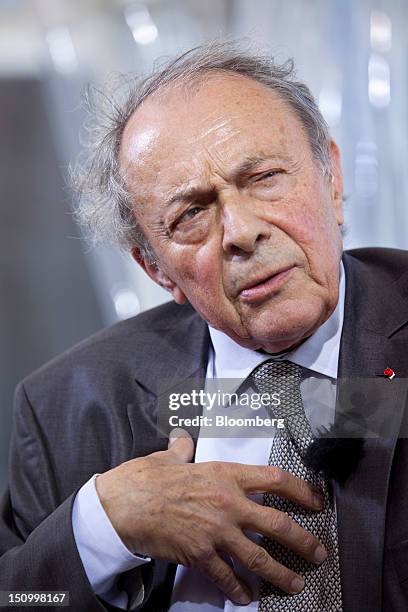 Michel Rocard, former French prime minister, speaks during a Bloomberg Television interview at the Mouvement des Enterprises de France conference at...