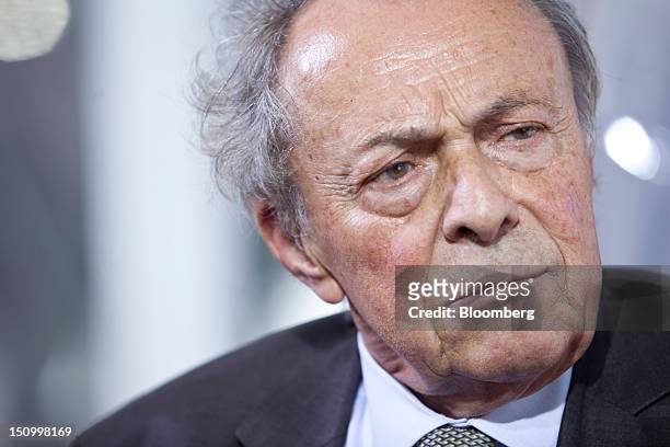 Michel Rocard, former French prime minister, pauses during a Bloomberg Television interview at the Mouvement des Enterprises de France conference at...
