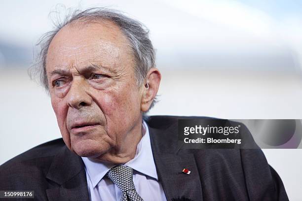 Michel Rocard, former French prime minister, speaks during a Bloomberg Television interview at the Mouvement des Enterprises de France conference at...