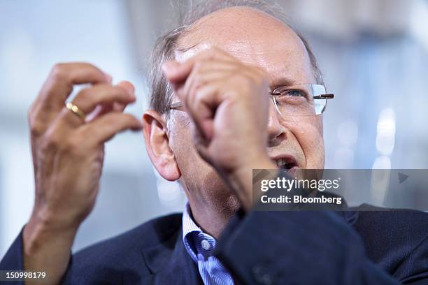 Ben Verwaayen, chief executive officer of Alcatel-Lucent SA, gestures whilst speaking during a Bloomberg Television interview at the Mouvement des...