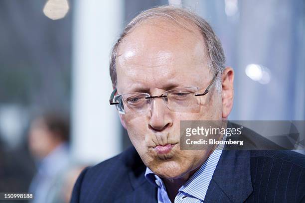 Ben Verwaayen, chief executive officer of Alcatel-Lucent SA, reacts during a Bloomberg Television interview at the Mouvement des Enterprises de...