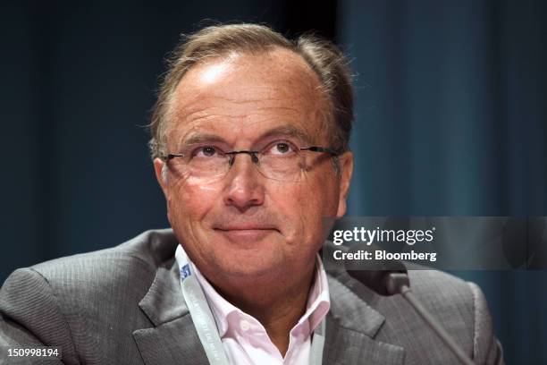 Jean-Pierre Letartre, president of Ernst & Young LLP France, reacts during a plenary session at the Mouvement des Enterprises de France conference at...