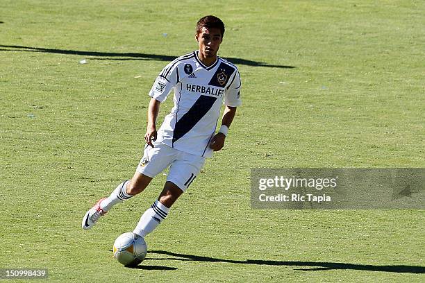 Hector Jimenez of Los Angeles Galaxy dribbles the ball during the MLS match against FC Dallas at The Home Depot Center on August 26, 2012 in Carson,...