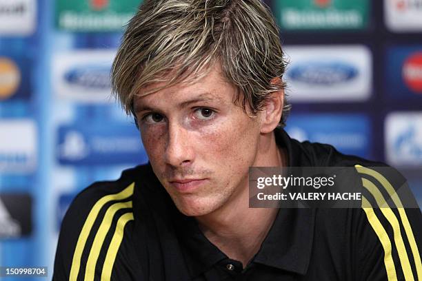 Chelsea's Spanish forward Fernando Torres listens during a press conference on the eve of the UEFA Super Cup football match Chelsea FC vs Club...