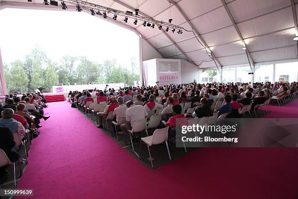 Visitors listen to the speakers during a session in the main hall of the Mouvement des Enterprises de France conference at Campus HEC in...