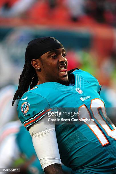 Clyde Gates of the Miami Dolphins stretches before the game against the Atlanta Falcons at Sun Fife Stadium on August 24, 2012 in Miami Gardens,...