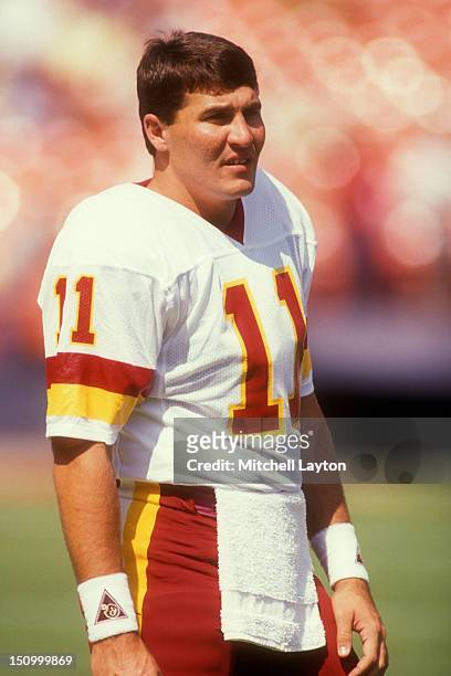 Mark Rypien of the Washington Redskins looks on before a football game against the Philadelphia Eagles on October 21, 1990 at RFK Stadium in...