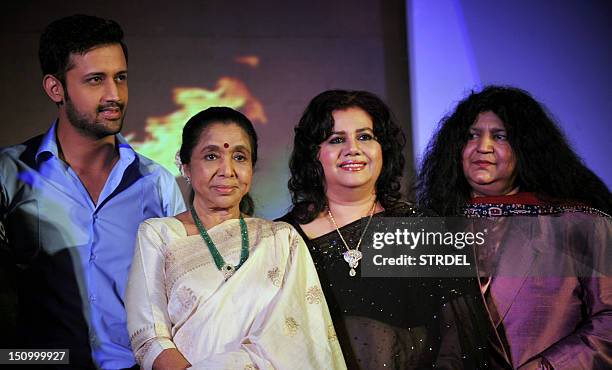 Pakistani pop singer Atif Aslam, Indian playback singer Asha Bhosle, Bangladeshi Singer Runa Laila and Pakistani Sufi Singer Abida Parveen pose...