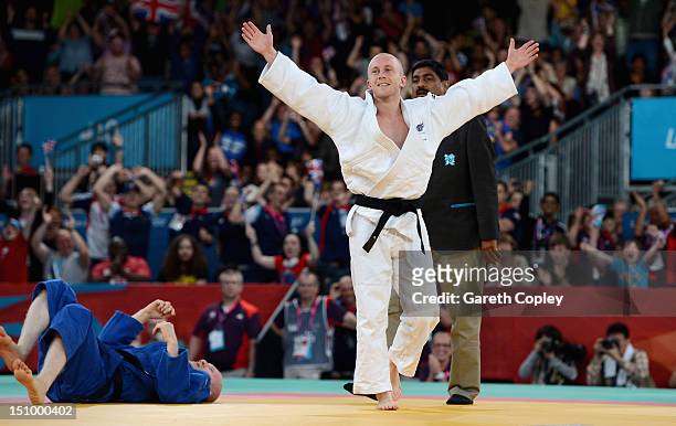 Ben Quilter of Great Britain celebrates beating Makoto Hirose of Japan to win the bronze medal in the Men's -60 kg Judo on day 1 of the London 2012...