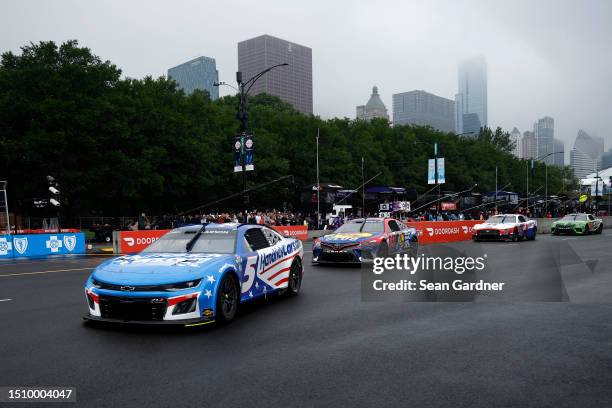 Kyle Larson, driver of the HendrickCars.com Chevrolet, Martin Truex Jr., driver of the Bass Pro Shops Toyota, Jenson Button, driver of the Mobil 1...