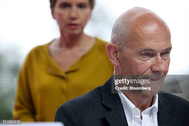 Laurence Parisot, president of the Mouvement des Enterprises de France , left, waits to take her seat beside Pascal Lamy, director-general of the...