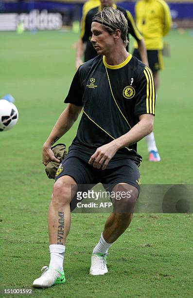 Chelsea's Spanish forward Fernando Torres takes part in a training session on August 30, 2012 at the Stade Louis II in Monaco, on the eve of the UEFA...