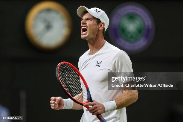 Andy Murray celebrates winning his second set against Stefanos Tsitsipas after hurting his groin during day four of The Championships Wimbledon 2023...