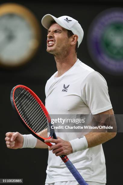 Andy Murray celebrates winning his second set against Stefanos Tsitsipas after hurting his groin during day four of The Championships Wimbledon 2023...